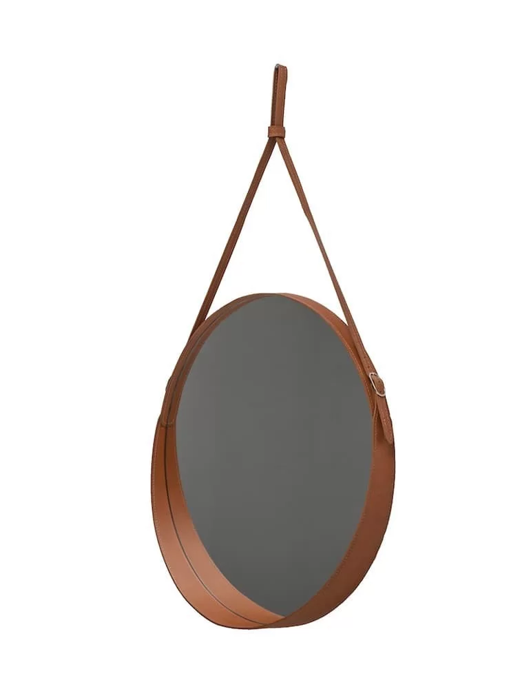 Miroir rond en cuir Corium, de Limac Design.