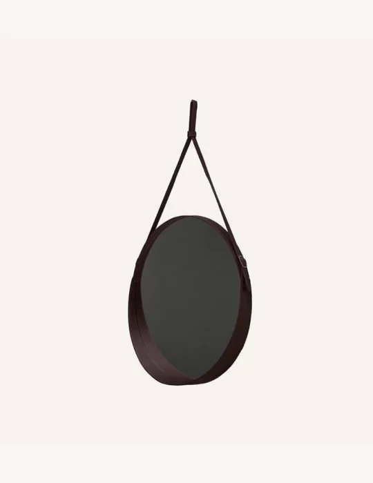 Miroir rond en cuir Corium, de Limac Design.